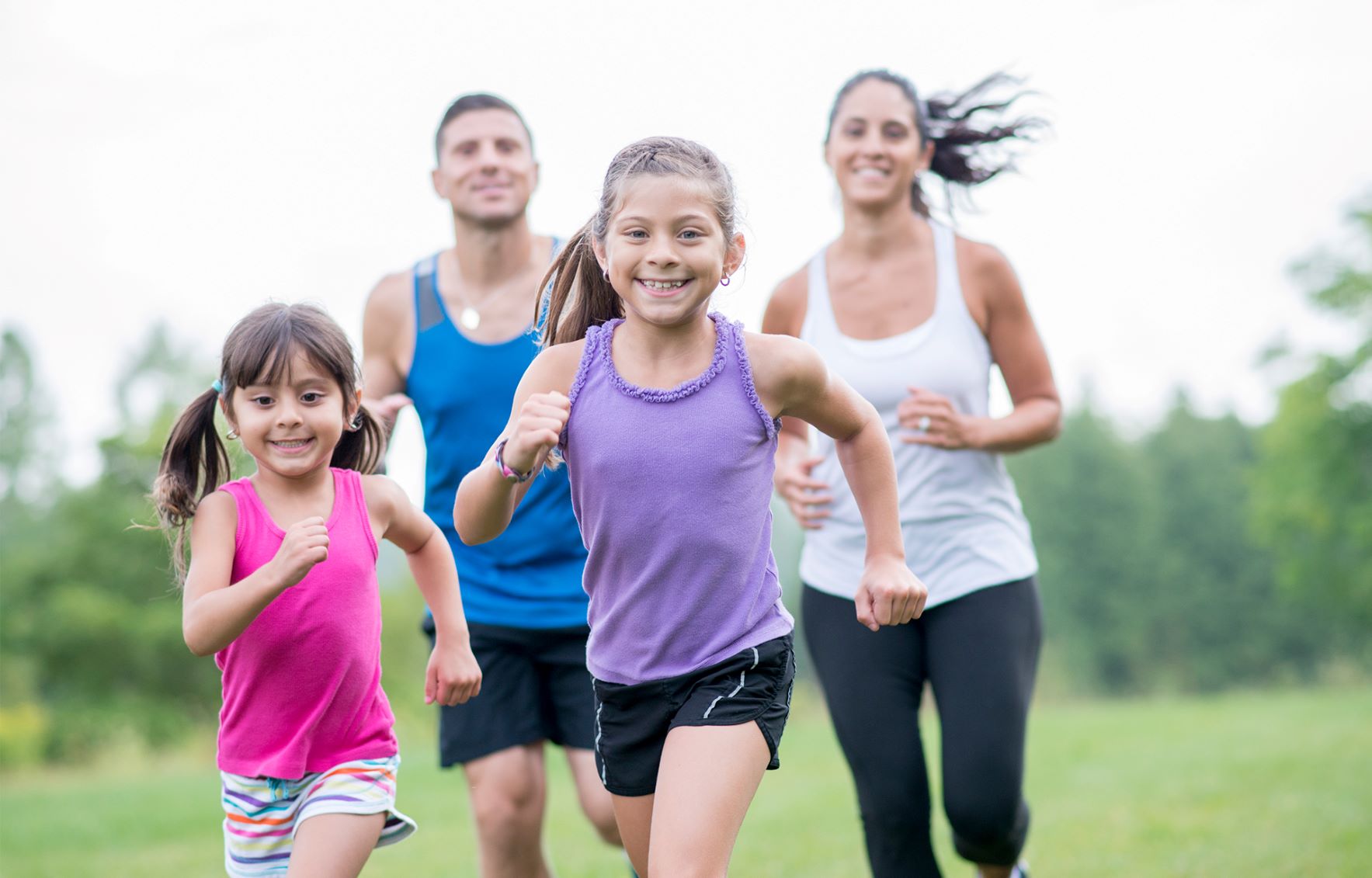A family of four running