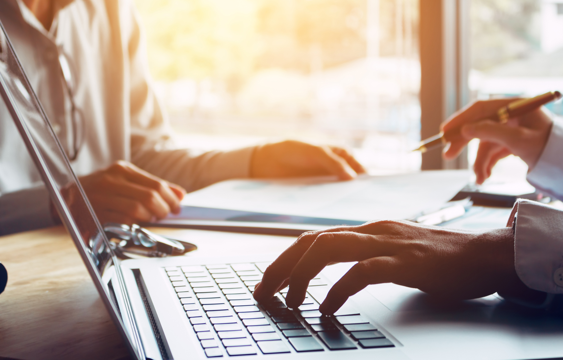 Person typing on laptop
