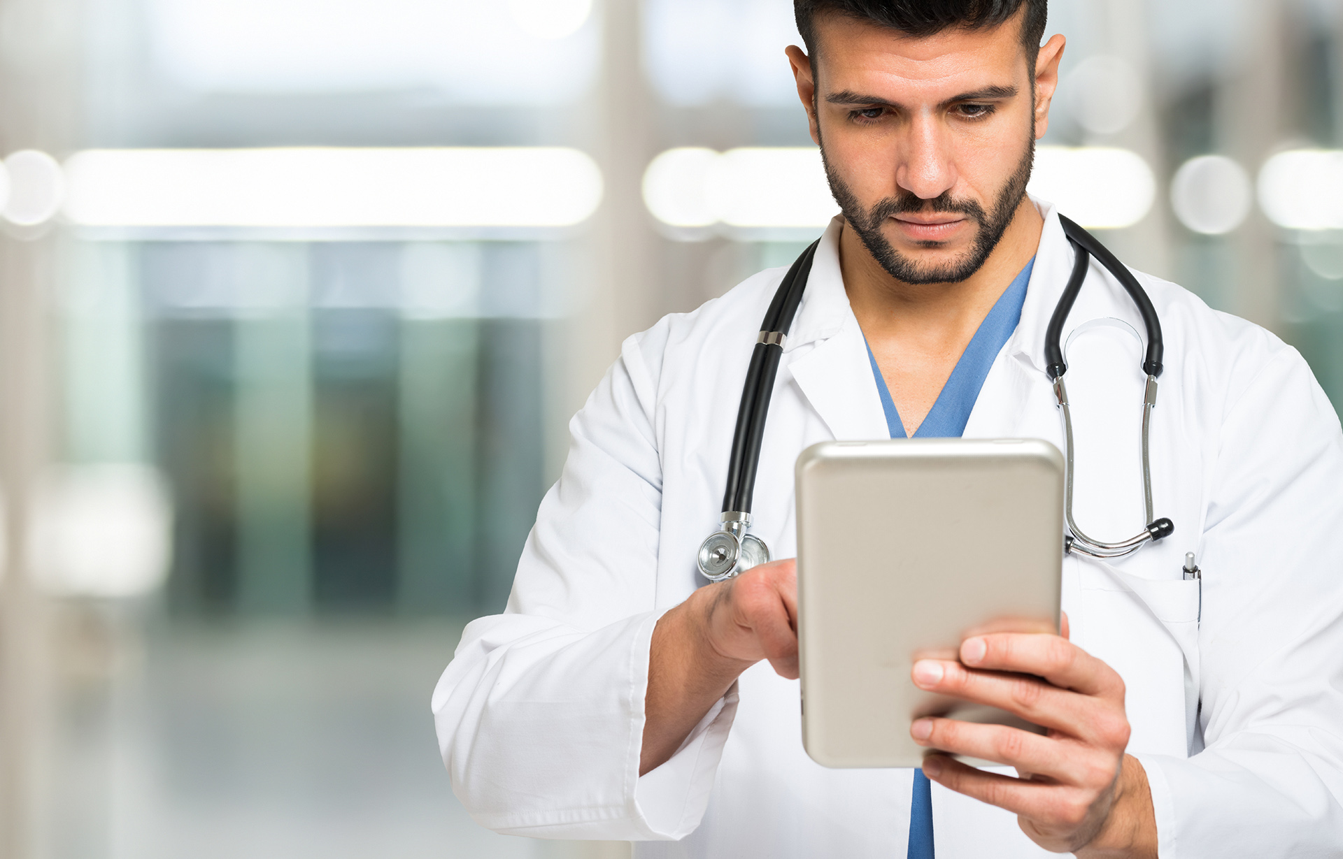 Doctor looking at tablet