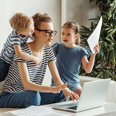 Mom with kids bothering her while trying to work