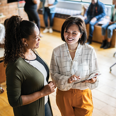 Two businesswomen talking with each other