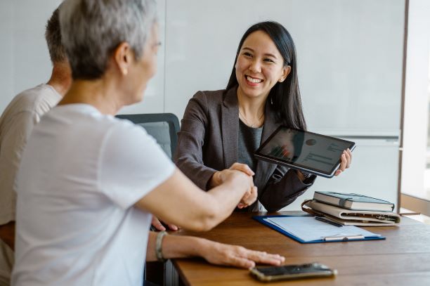 Two women shaking hands