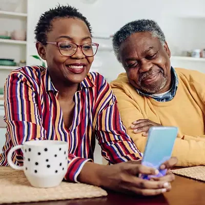 older couple looking at a phone
